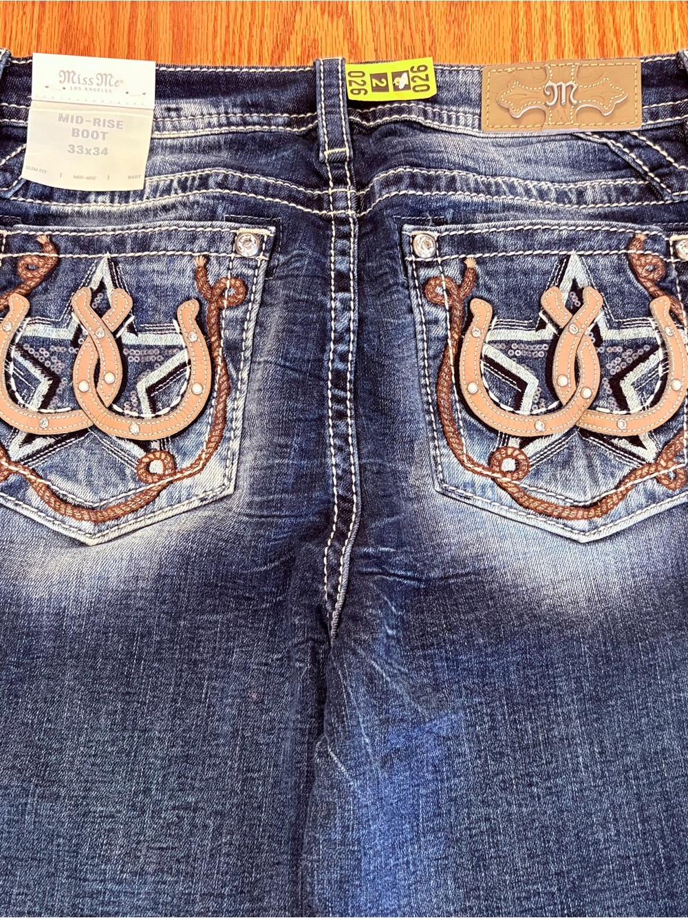 Miss Me Dark Blue Denim Mid-Rise Boot Jeans with Embroidered Pocket Detail - Picture 3 of 7